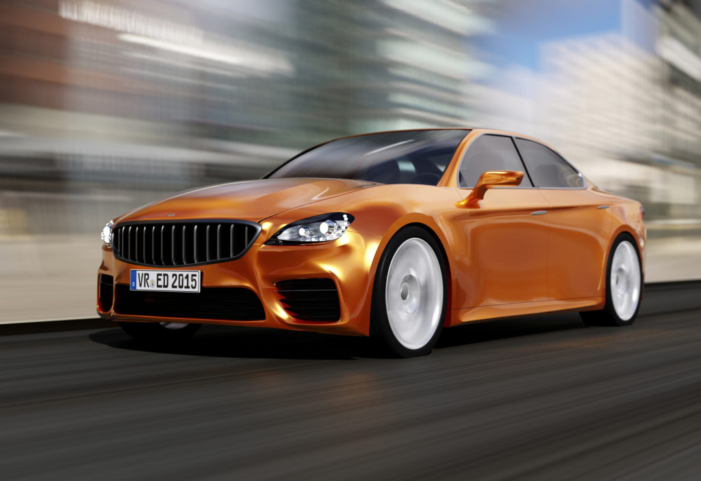 Unbadged orange luxury car on blurred background